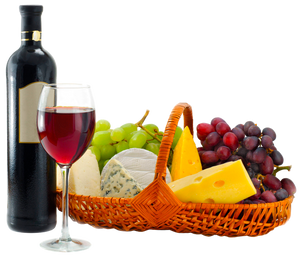 Wine bottle and glass of wine next to a basket assortment of fruits and cheeses with merlot.